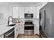 Efficient kitchen with stainless steel appliances, ample counter space, and modern cabinetry for easy meal preparation at 5555 E Briarwood Ave # 2604, Centennial, CO 80122