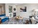 Comfortable living area featuring a modern fireplace, stylish furniture, and a decorative rug at 5555 E Briarwood Ave # 2604, Centennial, CO 80122