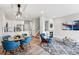 Cozy living room featuring a fireplace, comfortable seating, and an adjacent dining area with ample natural light at 5555 E Briarwood Ave # 2604, Centennial, CO 80122