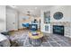 Open-concept living room adjacent to the kitchen with a fireplace, and comfortable seating at 5555 E Briarwood Ave # 2604, Centennial, CO 80122