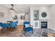 Open-concept living room adjacent to the kitchen with a fireplace, and comfortable seating at 5555 E Briarwood Ave # 2604, Centennial, CO 80122