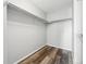 Spacious walk-in closet with built-in shelving and laminate wood-look flooring at 5555 E Briarwood Ave # 2604, Centennial, CO 80122