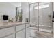 Stylish bathroom with a glass-enclosed shower, built-in bench, and plant accents at 3377 S Quartz St, Morrison, CO 80465