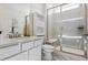 Modern bathroom boasts a glass-enclosed shower with a built-in bench and a stylish vanity at 3377 S Quartz St, Morrison, CO 80465