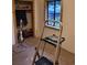 View of a bedroom featuring a closet and window, with the room staged for renovation with tools present at 4568 Apex Valley Rd, Golden, CO 80403