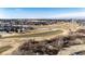 View of neighborhood homes, open space, and golf course from above at 23612 Glenmoor Dr, Parker, CO 80138