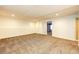 Finished basement features neutral carpet and white walls at 23612 Glenmoor Dr, Parker, CO 80138