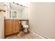 Functional bathroom featuring a toilet, vanity, and mirror, ready for personalization at 23612 Glenmoor Dr, Parker, CO 80138