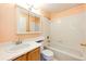 This cozy bathroom includes essential fixtures with a mirrored cabinet for storage and a relaxing bathtub at 23612 Glenmoor Dr, Parker, CO 80138