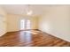 Bedroom with laminate flooring, vaulted ceiling, ceiling fan, and access to a private deck through glass doors at 23612 Glenmoor Dr, Parker, CO 80138