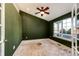 Green bedroom featuring natural light from the window and a ceiling fan for comfort at 23612 Glenmoor Dr, Parker, CO 80138