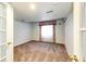 Bedroom features neutral carpet, white walls and large window with curtains at 23612 Glenmoor Dr, Parker, CO 80138