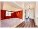 Formal dining room featuring a modern chandelier, large window, and warm lighting at 23612 Glenmoor Dr, Parker, CO 80138