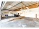 Spacious garage with high ceiling and ramp to the house at 23612 Glenmoor Dr, Parker, CO 80138