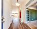 Bright and airy hallway with hardwood floors at 23612 Glenmoor Dr, Parker, CO 80138