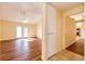 Spacious living room with vaulted ceiling, ceiling fan, hardwood floors, and access to a deck through glass doors at 23612 Glenmoor Dr, Parker, CO 80138