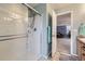 Ensuite bath with glass enclosed shower, modern fixtures and light blue walls at 277 Jewel St, Brighton, CO 80603