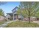 Lovely two-story home with a covered porch, stone accents, and a well-maintained front yard at 277 Jewel St, Brighton, CO 80603