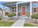 Inviting front porch with cozy seating, stone accents, and a charming entryway at 277 Jewel St, Brighton, CO 80603
