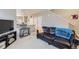 Comfortable living room with a view of the kitchen and a staircase, perfect for entertaining at 277 Jewel St, Brighton, CO 80603