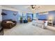 Spacious main bedroom with sitting area, carpet flooring, ceiling fan and ensuite bath at 277 Jewel St, Brighton, CO 80603