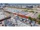 Aerial view of modern townhomes with rooftop decks and industrial buildings at 3008 Blake St, Denver, CO 80205