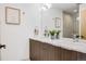 Bathroom featuring double sink vanity, sleek countertops, and modern fixtures at 3008 Blake St, Denver, CO 80205