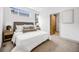 Bright bedroom featuring neutral decor, plush bedding, and natural light at 3008 Blake St, Denver, CO 80205
