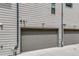 Garage doors with concrete driveway on side of the home's exterior at 3008 Blake St, Denver, CO 80205