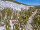 Aerial view of a wooden home among a snowy mountain and a highway at 6087 Highway 9, Breckenridge, CO 80424