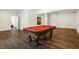Spacious finished basement with a pool table and a doorway to another room at 6087 Highway 9, Breckenridge, CO 80424
