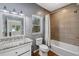 Elegant bathroom featuring granite vanity top, tile accents, and a shower-tub combo at 6087 Highway 9, Breckenridge, CO 80424