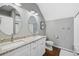 Bathroom featuring double sinks, white cabinetry, and natural lighting at 6087 Highway 9, Breckenridge, CO 80424