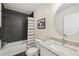 Well-lit bathroom with a shower and tub combination, granite countertops, and a large mirror at 6087 Highway 9, Breckenridge, CO 80424