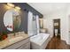 Beautiful bathroom with a soaking tub, granite counters, and tiled shower at 6087 Highway 9, Breckenridge, CO 80424