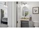 Small ensuite bathroom with a granite vanity and grey cabinets at 6087 Highway 9, Breckenridge, CO 80424