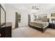 Spacious bedroom featuring a plush bed, dark wood furniture, and scenic views from the windows at 6087 Highway 9, Breckenridge, CO 80424