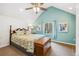 Charming bedroom with bright, airy space, vaulted ceiling, and wooded view at 6087 Highway 9, Breckenridge, CO 80424