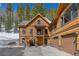 Exterior featuring wood siding and a two car garage at 6087 Highway 9, Breckenridge, CO 80424