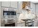 Modern kitchen featuring stainless steel appliances, white subway tile backsplash, and stylish granite countertops at 6087 Highway 9, Breckenridge, CO 80424