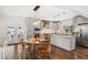 Bright eat-in kitchen featuring stainless steel appliances, shaker cabinets, and a beautiful breakfast nook at 6087 Highway 9, Breckenridge, CO 80424