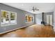 Living room with wood floors, windows with outdoor views, and a cozy fireplace at 6087 Highway 9, Breckenridge, CO 80424
