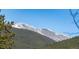 View of green, tree covered mountains with some remaining snow on top at 6087 Highway 9, Breckenridge, CO 80424