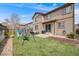 Spacious backyard with a play set, patio, and well-maintained lawn perfect for Gathering activities and outdoor enjoyment at 12678 Fisher Ln, Englewood, CO 80112