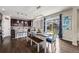Bright dining area with modern lighting, access to the backyard, and stylish decor at 12678 Fisher Ln, Englewood, CO 80112