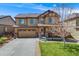 Inviting two-story home with a two-car garage and well-maintained landscaping at 12678 Fisher Ln, Englewood, CO 80112