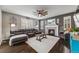 Cozy living room with a fireplace, a ceiling fan and comfortable seating at 12678 Fisher Ln, Englewood, CO 80112