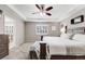 This is a beautifully designed main bedroom with a tray ceiling, ceiling fan and an ensuite bath at 12678 Fisher Ln, Englewood, CO 80112