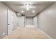 Finished basement with carpet, multiple doors, and ample space for recreation or storage at 7099 Cerney Cir, Castle Pines, CO 80108