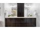 Bathroom featuring and sinks with shaker cabinetry and plenty of storage at 7099 Cerney Cir, Castle Pines, CO 80108